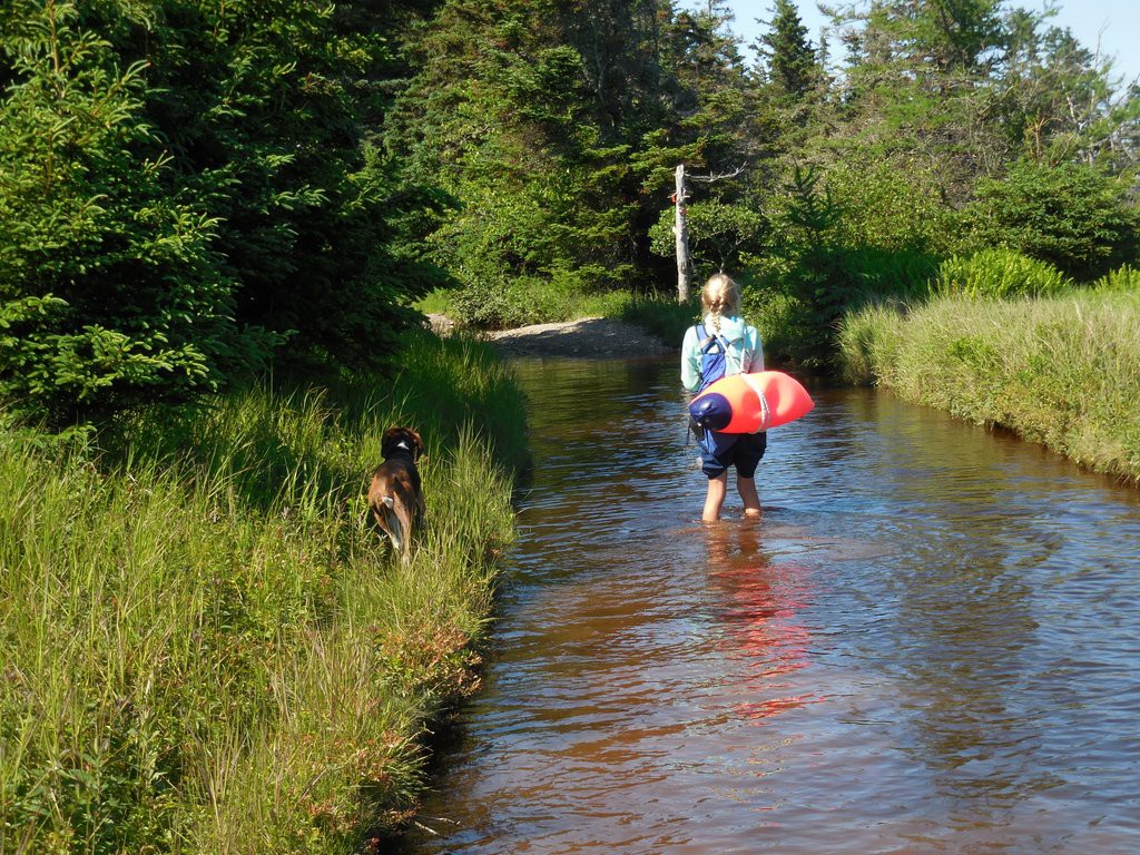 Carrying a huge buoy down the "trail"